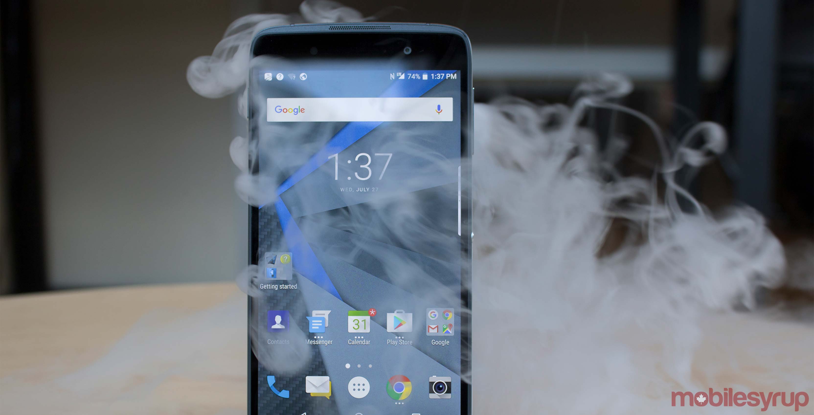 BlackBerry DTEK50 with dry ice behind it
