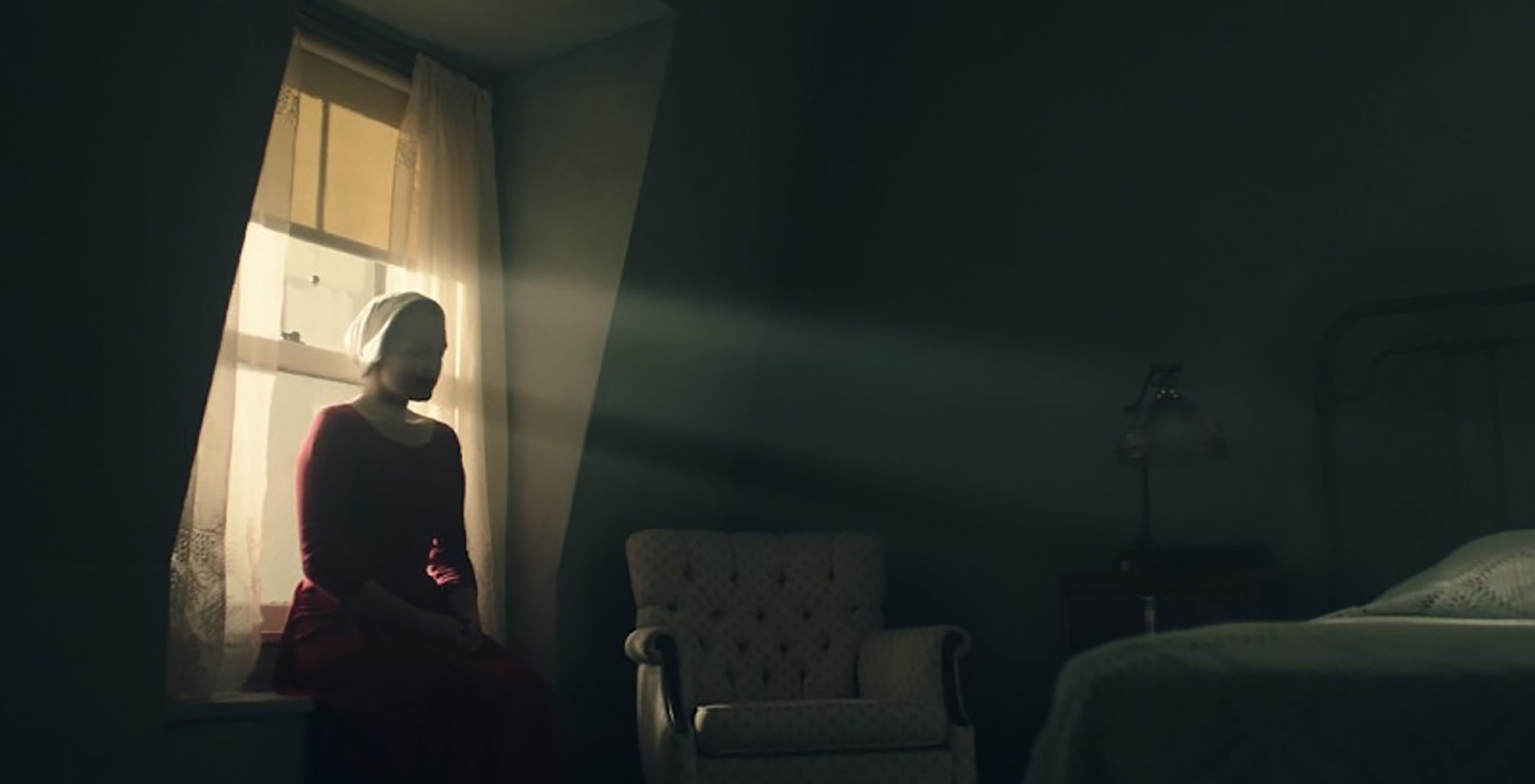 The Handmaid's Tale woman sitting