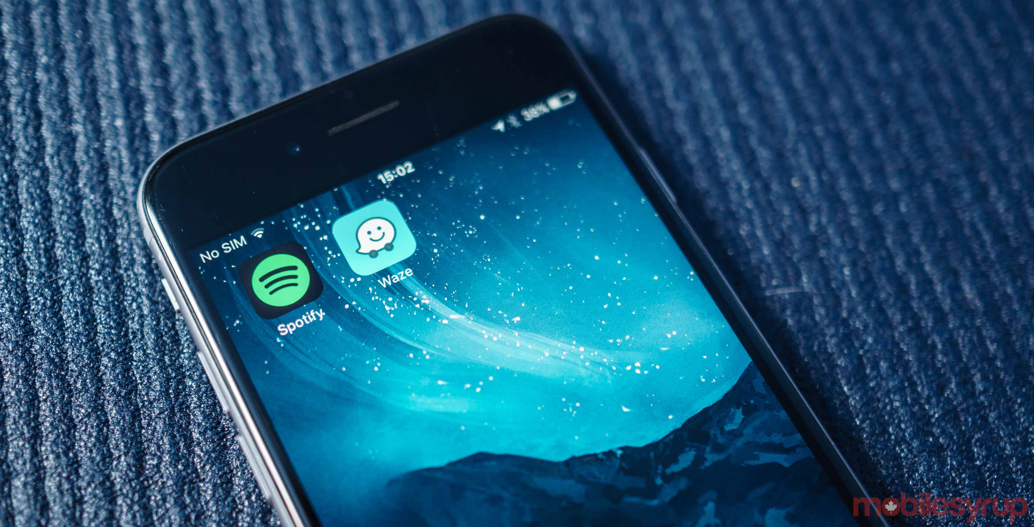 Spotify and Waze app icons on iPhone homescreen
