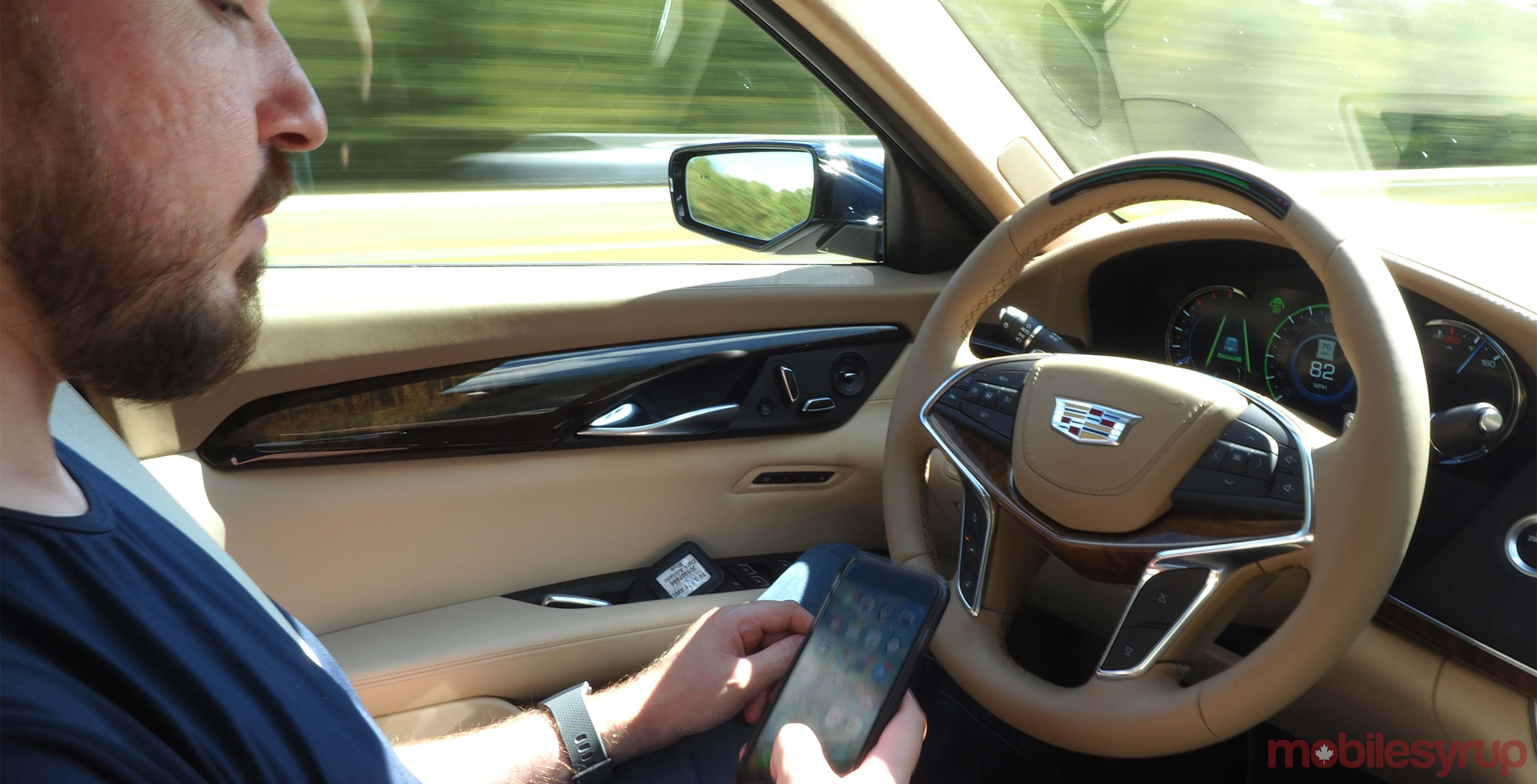 Cadillac CT6 Super Cruise holding phone