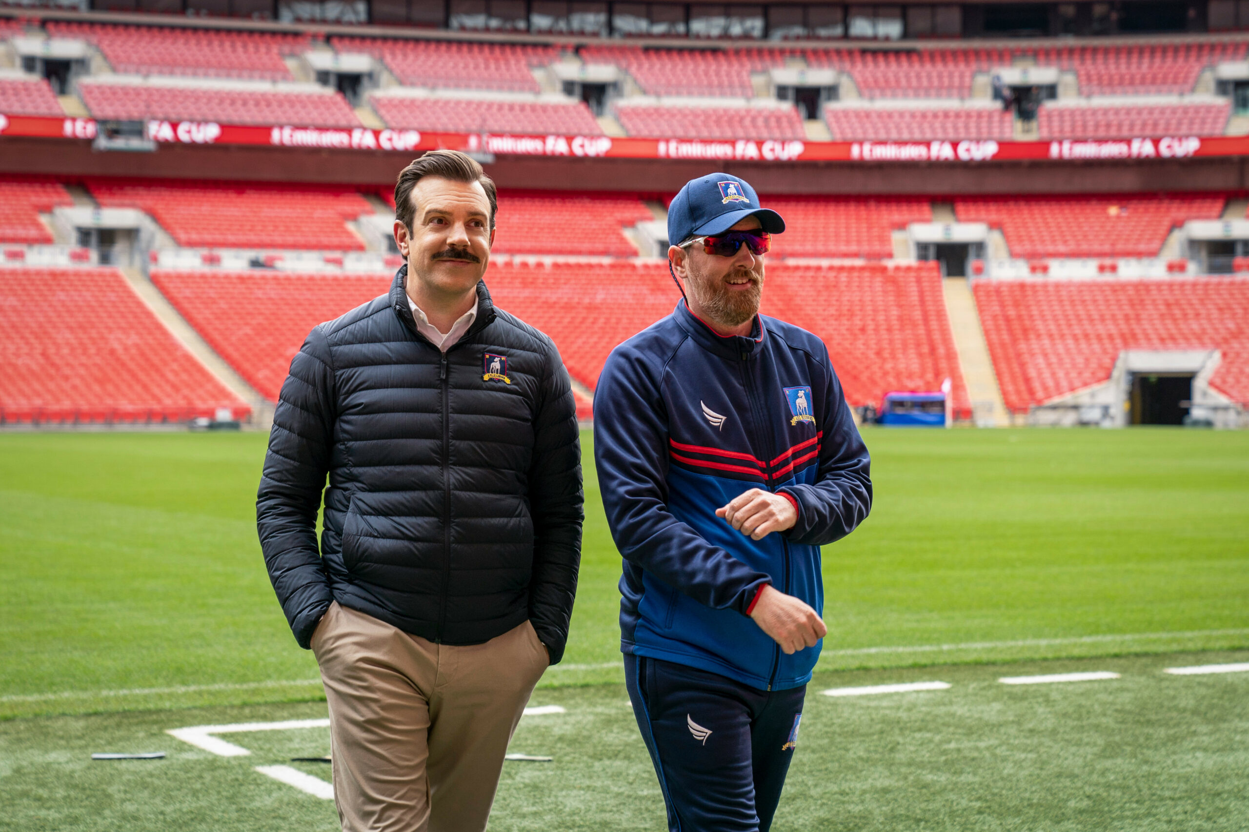 Ted Lasso and Coach Beard on field