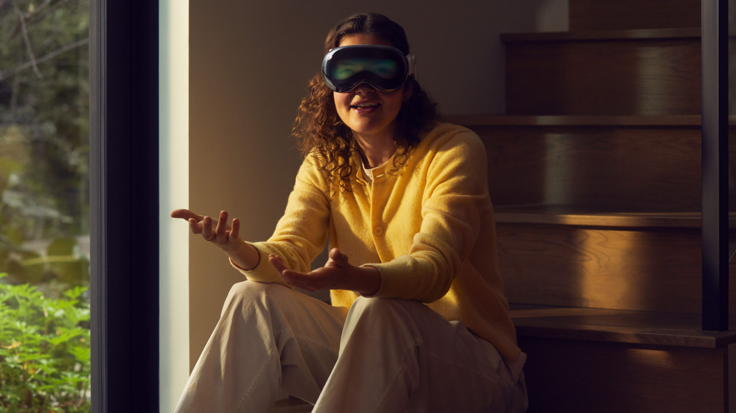 Person wearing Apple Vision Pro header.