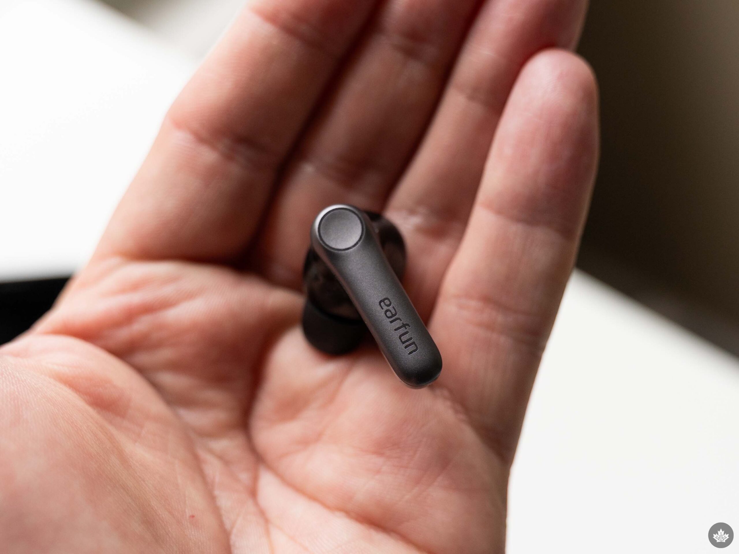 EarFun Air Pro 4+ earbuds resting on a hand.