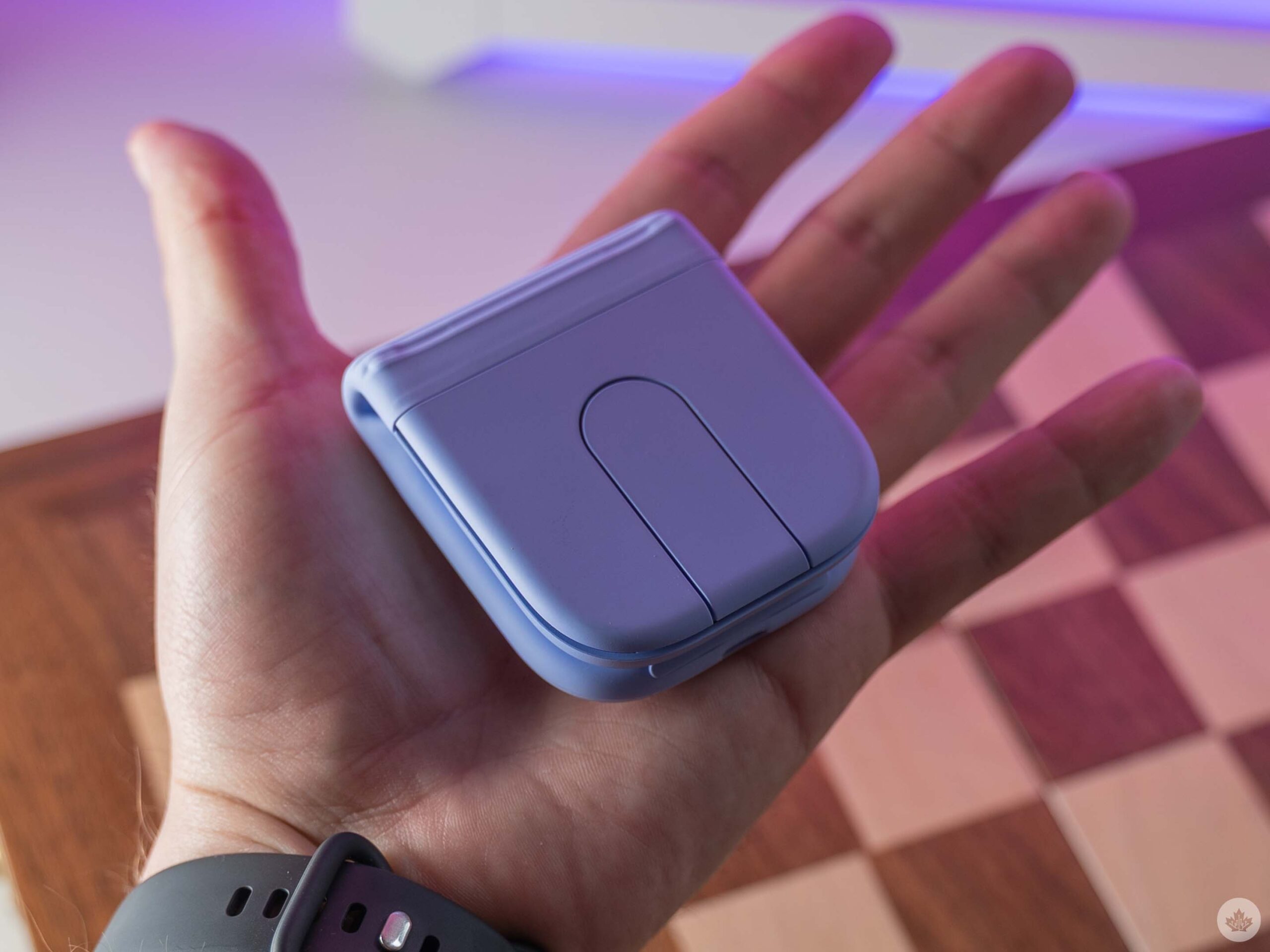 Logitech Mobi Fold folded in a hand.