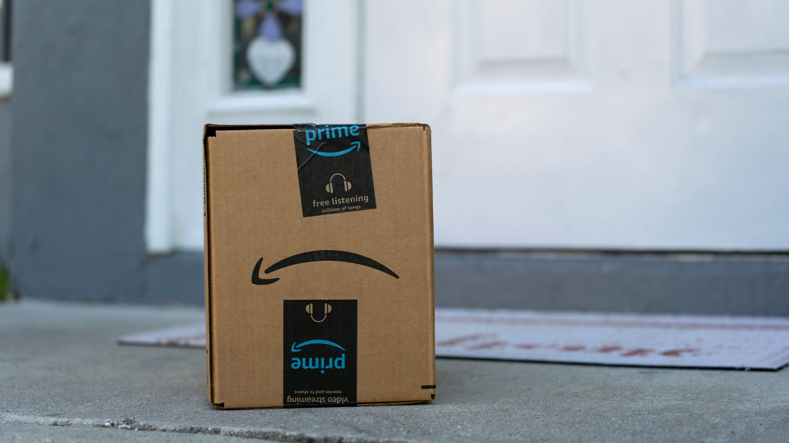 Amazon Prime box sitting on a doorstep.