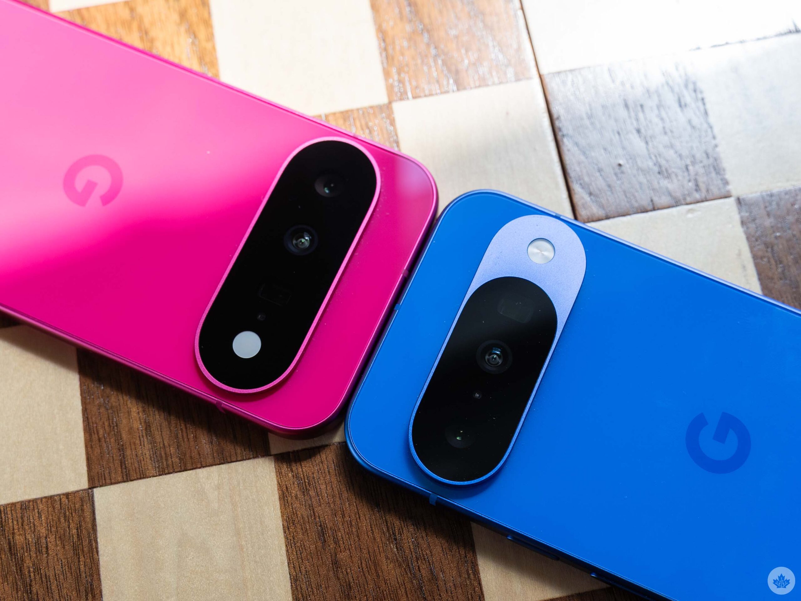 Pixel 11 (left, pink) and Pixel 10 (right, blue) camera bumps.