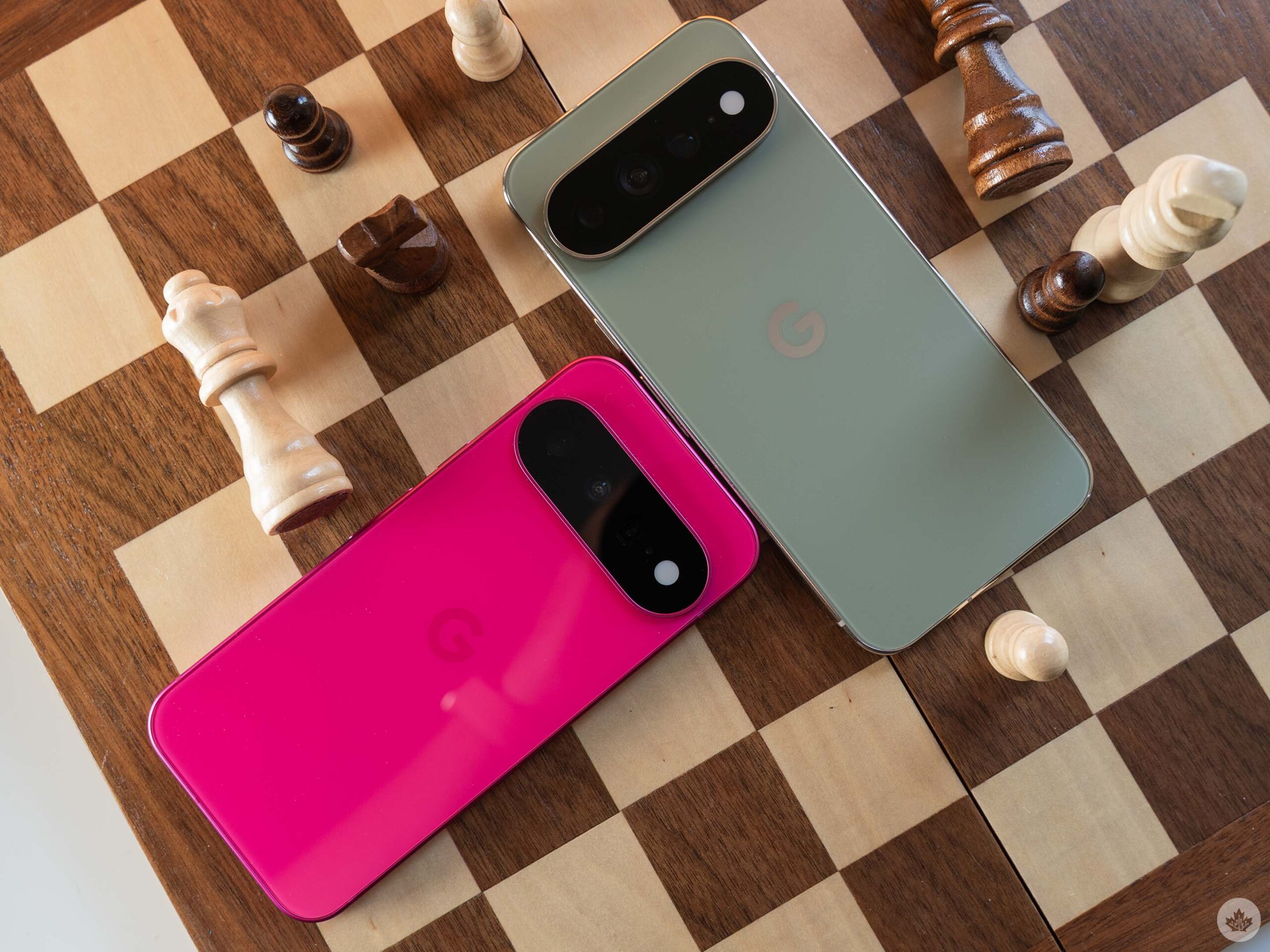 Pixel 11 (left, pink) and Pixel 11 Pro XL (right, green).