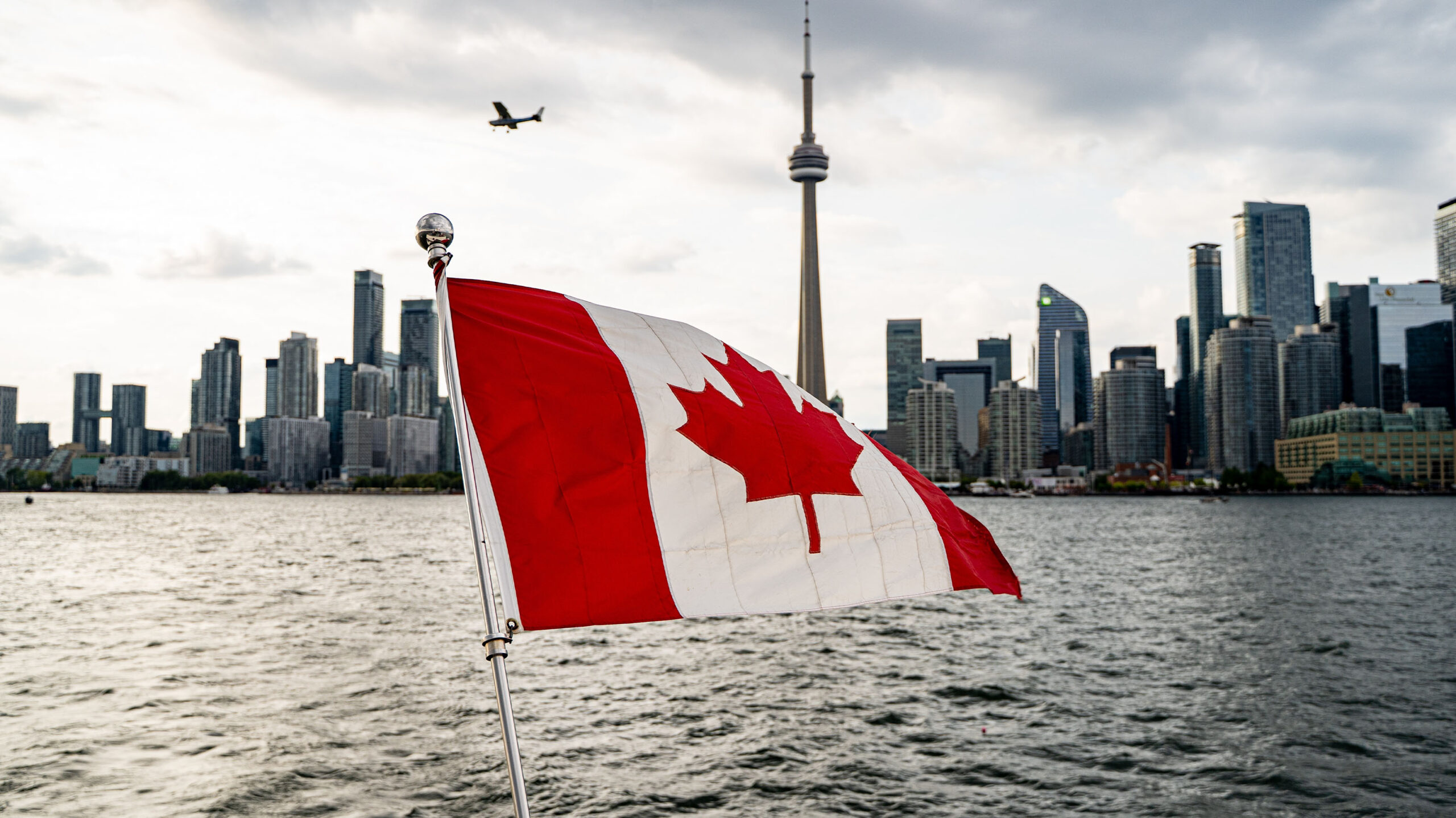Canada flag with Toronto in the background.